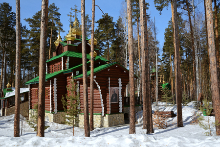 Wooden Russian Orthodox Christian Church of St. Sergius of Radonezh in Ganina Yama Monastery on early Spring, Yekaterinburg, Russia.の写真素材