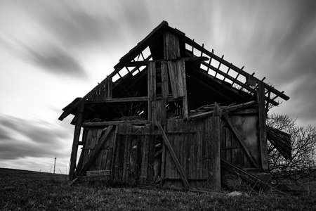 Front view of an old spooky abandoned barnの写真素材