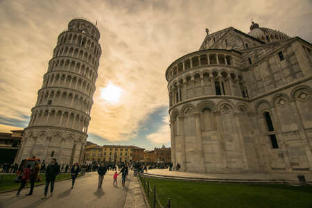 Pisa / Italy - 03/01/2019 - A beautiful day in Pisa. In the background many tourists enjoying the leaning tower. Campo dei Miracoli.のeditorial素材