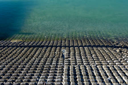 A coastal bank is stabilised using corrugated concreteの写真素材