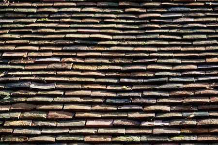 The lines of slate shingles on a roofの写真素材