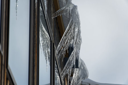 Long, frozen icicles hang down highlighting the grips of winter.