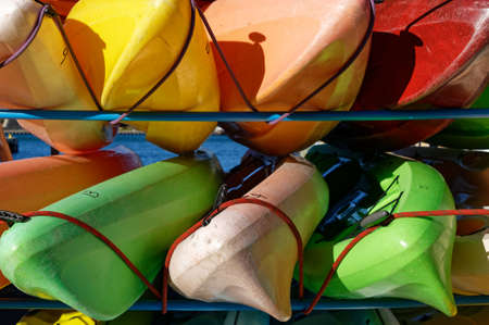Colourful kayaks are stored awaiting useの写真素材