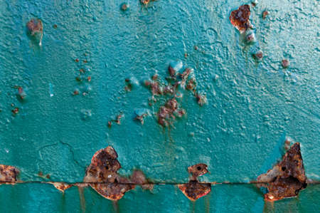 Bubbles in paint work as rust works on the metal underneathの写真素材