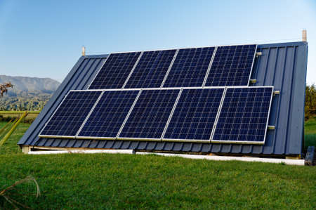 Solar panels power an off grid electricity systemの写真素材