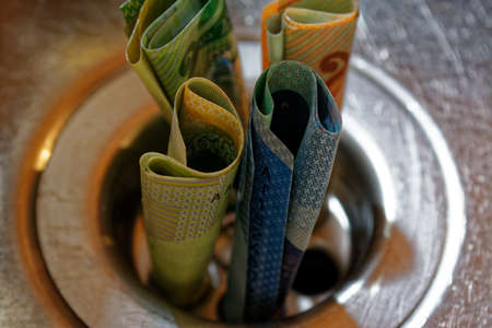 A close up of New Zealand dollars in a plug holeの写真素材