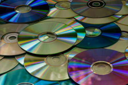 A pile of multicolored cds lie in a pileの写真素材