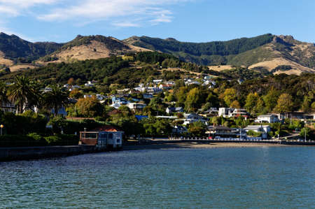 The town of Akaroa in Banks Peninsula, South Island, New Zealandの写真素材