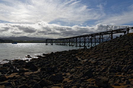 Moreraki Wharf or jetty juts out into the sea in New Zealand's South Islandの写真素材