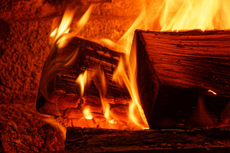 An open fire provides winter warmth, the orange flames are dancing