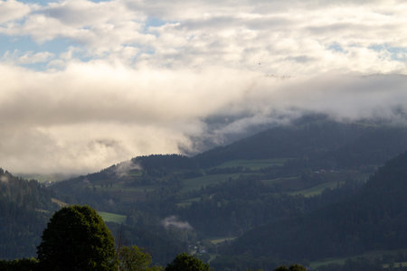 Vista over the Austrian mountains, just after sunrise.の写真素材