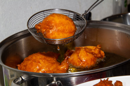 Frying doughnuts for new years eve