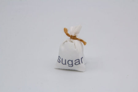 A bag of sugar isolated on a white backgroundの写真素材