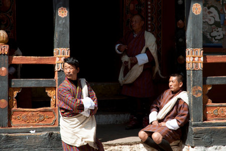 PARO, BHUTAN - March 15, 2012: Men wearing the traditional Bhutanese costume in Rinpung Dzongのeditorial素材