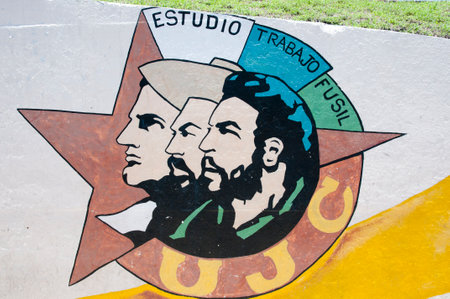 HAVANA, CUBA - June 7, 2015: Logo of "Young Communist League" (UJC) with faces of Julio Antonio Mella, Camilo Cienfuegos & Che Guevara. The motto means "Study, Work, Rifle".のeditorial素材