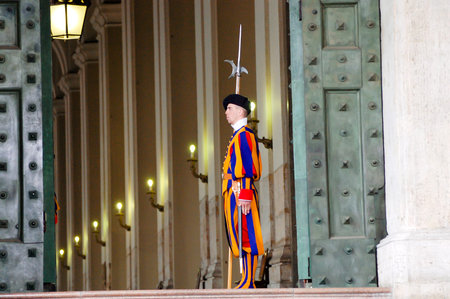VATICAN CITY, VATICAN - MARCH 20, 2010: Swiss guard standing ground in Saint Peters Basilicaのeditorial素材
