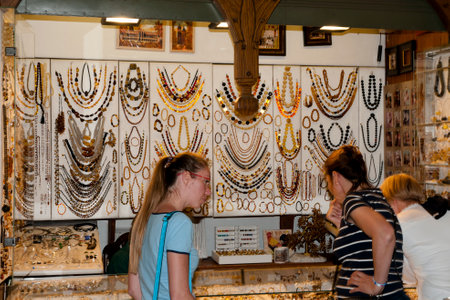 KRAKOW, POLAND - Jully 7, 2016: Cloth Hall (Sukiennice) amber shop in the heart of the town squareのeditorial素材