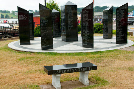 LUNENBURG, CANADA - August 14, 2016: The Fishermen's Memorial is composed of black granite columns with the names of fishermen from Lunenburg who lost their lives at sea from 1890 until the presentのeditorial素材