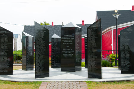 LUNENBURG, CANADA - August 14, 2016: The Fishermen's Memorial is composed of black granite columns with the names of fishermen from Lunenburg who lost their lives at sea from 1890 until the presentのeditorial素材