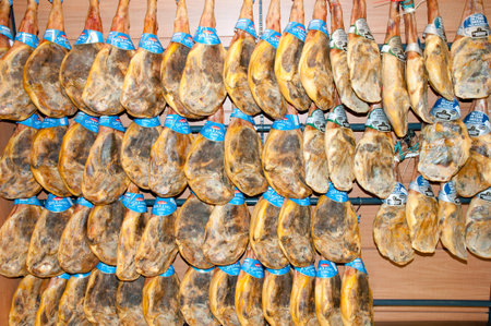 BARCELONA, SPAIN - May 25, 2016: Iberian ham legs hanging in a store. The meat is a type of cured ham and produced in Spain & Portugalのeditorial素材