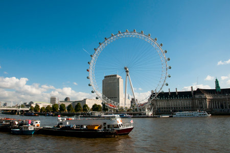 LONDON, UNITED KINGDOM - October 10, 2012: Iconic "London Eye" ferris wheel on the banks of Thames riverのeditorial素材