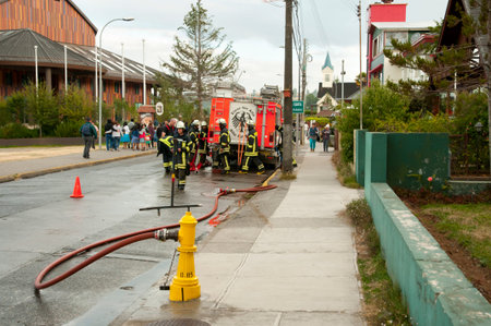 FRUTILLAR, CHILE - February 17, 2015: Firemen practice drill on the main street