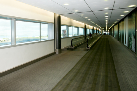 Moving Walkway in Airport Corridorの写真素材