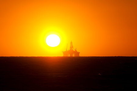 Ocean Oil Rig with Sunset