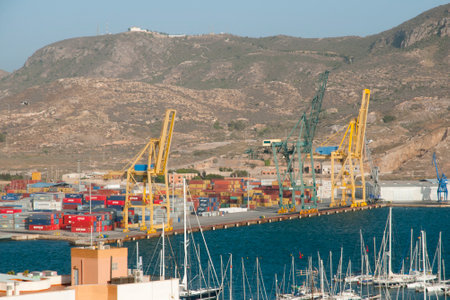 CARTAGENA, SPAIN - 28, 2016: Commercial cranes & shipping containers in the port of Cartagenaのeditorial素材
