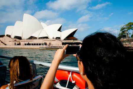 SYDNEY, AUSTRALIA - April 6, 2018: Tourist taking a photo of iconic Opera Houseのeditorial素材
