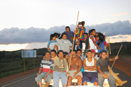 CIUDAD BOLIVAR, VENEZUELA - May 12, 2009: Happy locals riding on the street in the back of a pickup truckのeditorial素材