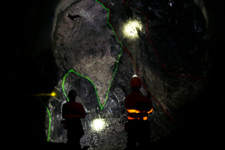 Underground Geologist in Mining Tunnel