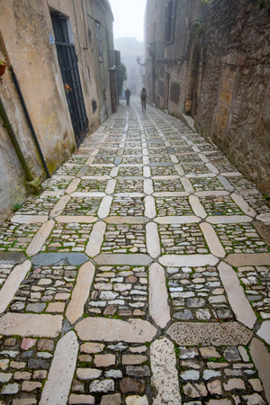 Pedestrian Cobblestone Street in Erice - Sicily - Italyの写真素材