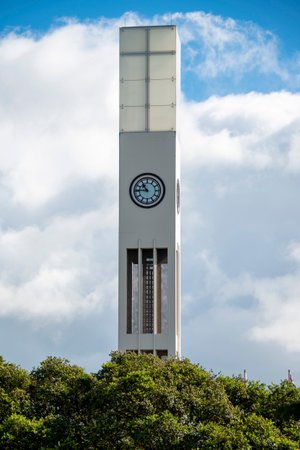 Tower clock with blue sky and white cloud background, Thailand.の写真素材