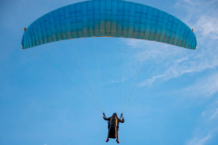 Paraglider in the blue sky. Paragliding in the blue sky.の写真素材
