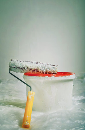 Paint roller and bucket ready for useの写真素材