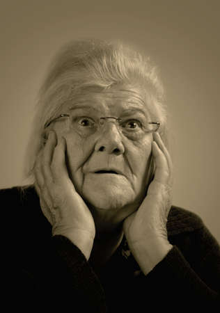 Scared elderly woman.の写真素材