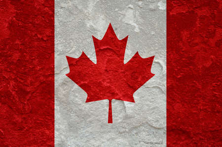 Canada flag on old grunge wall backgroundの写真素材