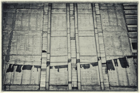 Shadows on the wall. Black and white image stylized as vintage postcard.の写真素材