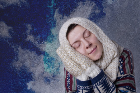 Portrait of woman with scarf and gloves. Dreaming concept.