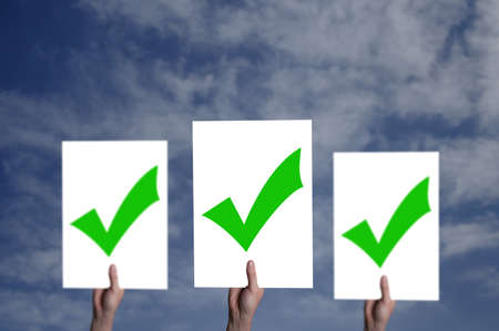 White billboard with a check mark on itの写真素材