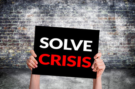 Solve crisis card with brick wall backgroundの写真素材