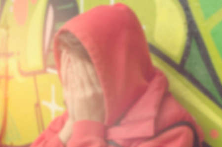 Blurred lonely person on street abstract background.の写真素材