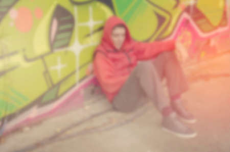 Blurred lonely person on street abstract background.の写真素材