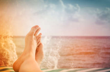 Legs on the background of the sea.の写真素材