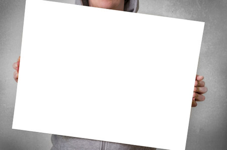 Man holding blank white banner with copy space for your text.の写真素材