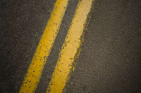 Double yellow line on asphalt road.の写真素材
