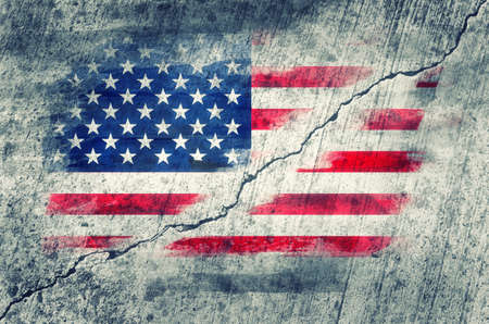 American flag painted on a wall cracked in the middle. Toned image.の写真素材