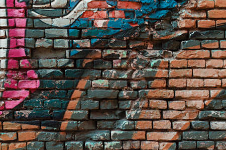 Grunge Graffiti brick wall background textureの写真素材