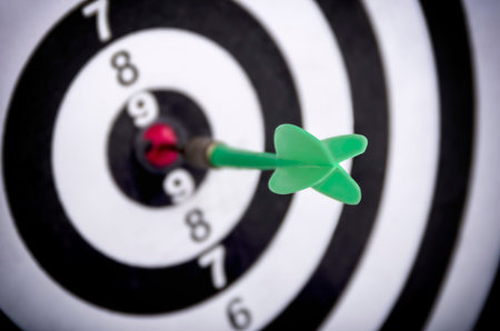 Dart hitting the center of target